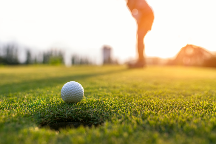 Golfer putting one of myrtle beach golf courses