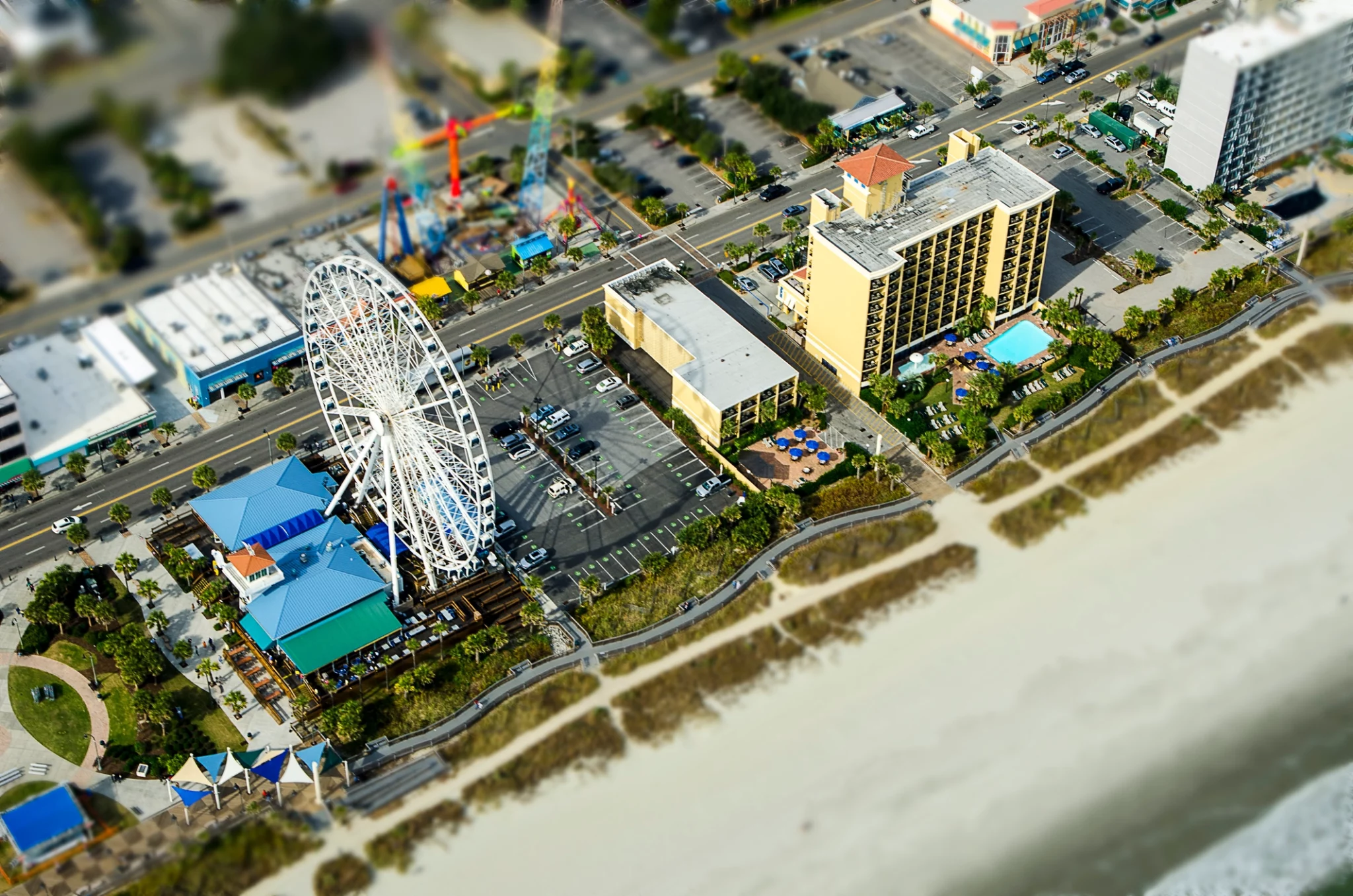 An aerial view of a hotel and its surroundings.