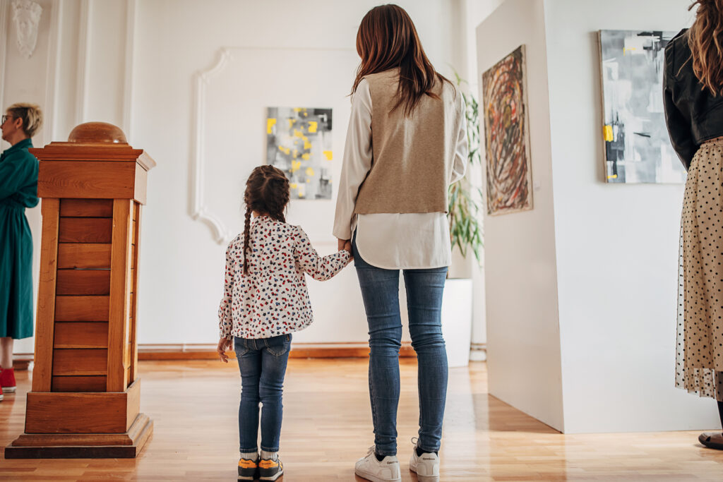 Mother and daughter at an art museum.